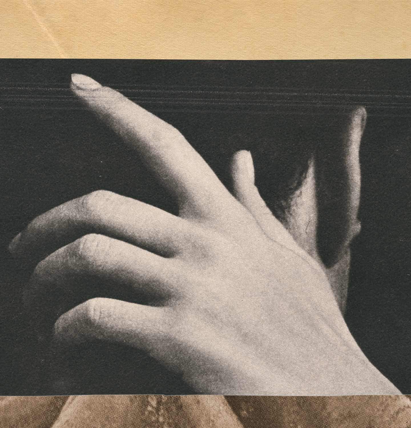 Hands in black and white film placed in front of textured background